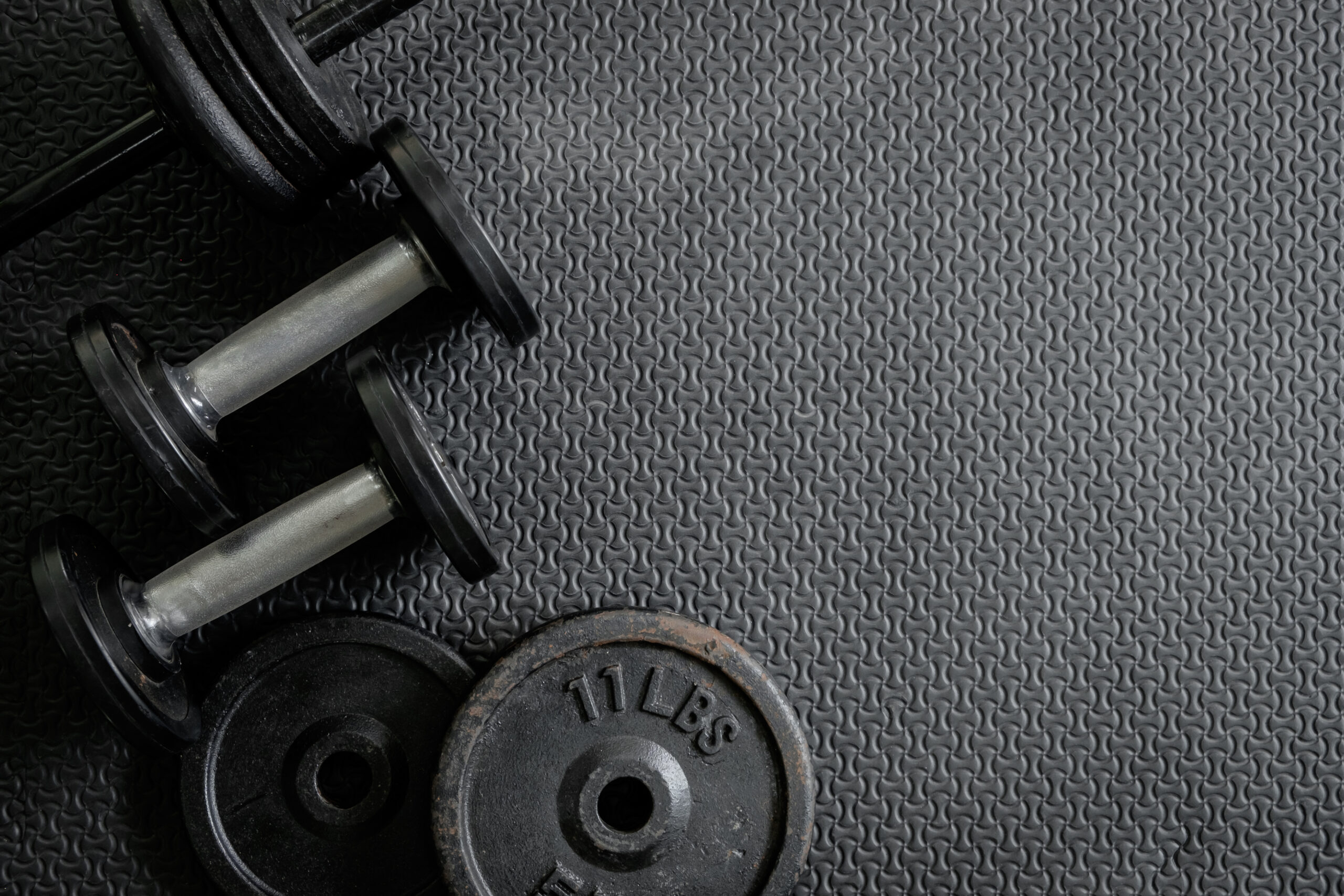 exercise weights - iron dumbbell with extra plates.